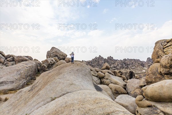 Woman looking at Alabama Hills