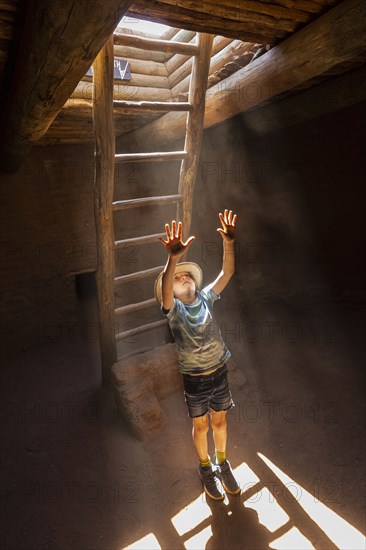 Boy exploring Native American kiva