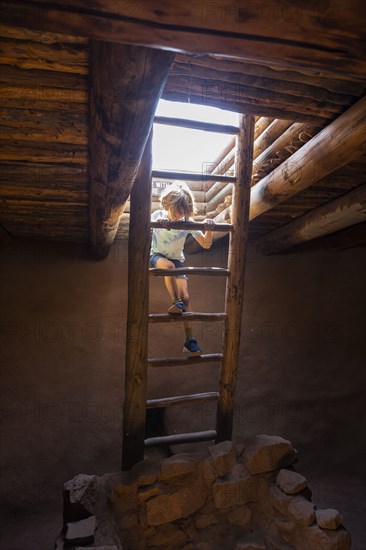 Boy exploring Native American kiva