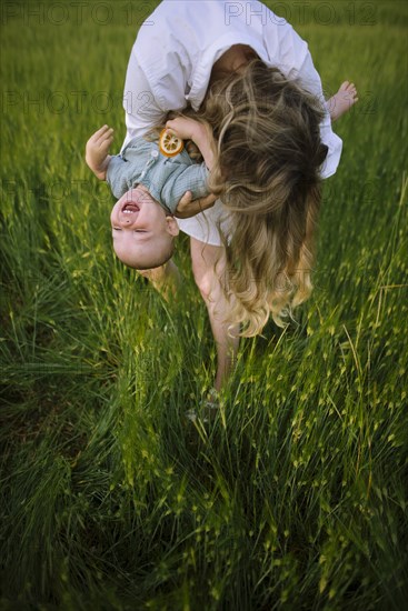 Mother playing with baby son