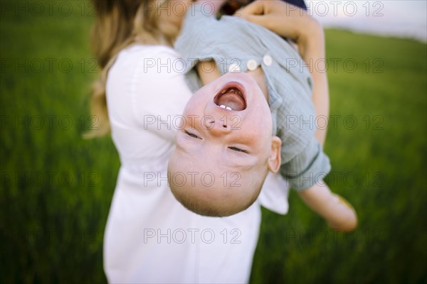 Mother playing with baby son