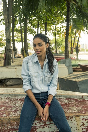 Woman sitting on upside