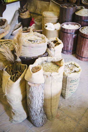 Close up of sacks of grain for sale in market