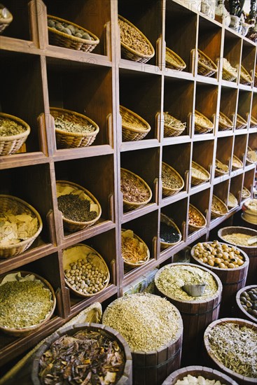 Shelves of sacks of grain for sale in market