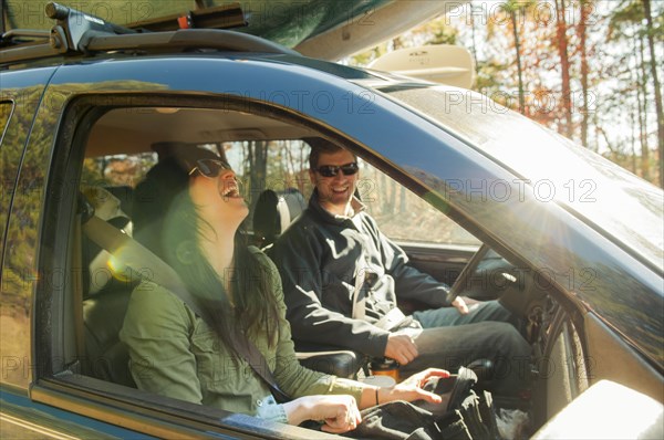 Couple driving in car