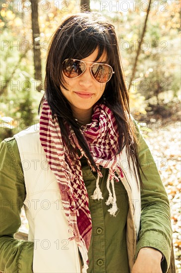 Caucasian woman smiling in forest