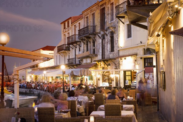 Time lapse view of sidewalk cafe at sunset