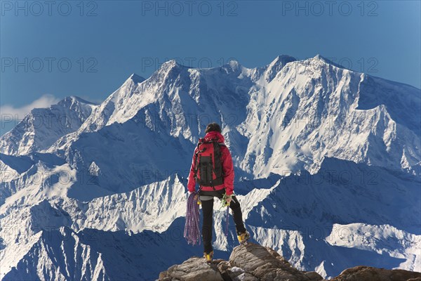 Caucasian hiker admiring scenic view from mountaintop