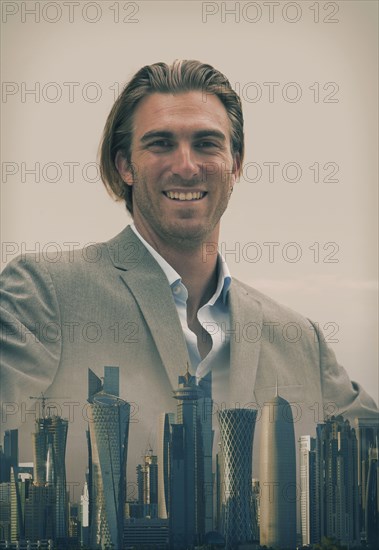 Caucasian businessman over Doha cityscape