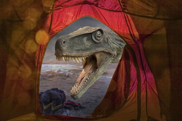 Dinosaur roaring outside tent at remote campsite