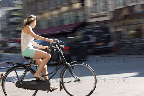 Blurred view of bicyclist on city street