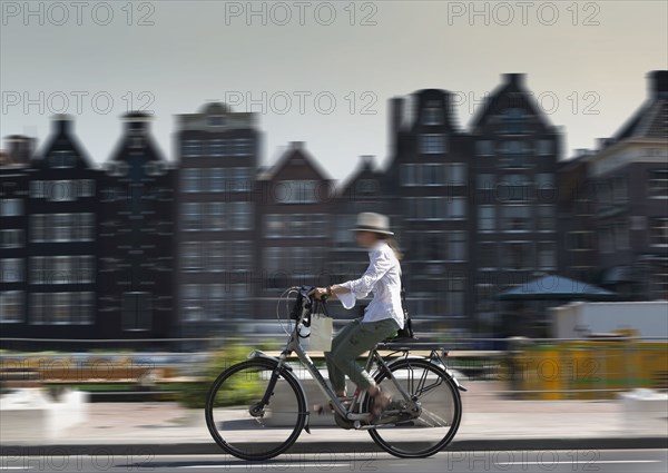 Blurred view of bicyclist on Amsterdam street