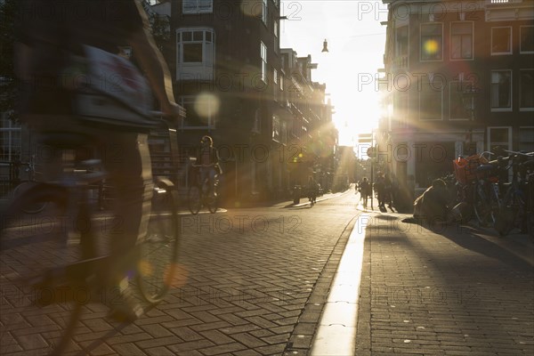 Blurred view of bicyclist on city street