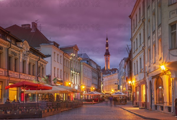 Illuminated street in cityscape