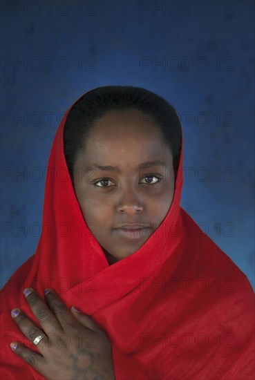 Smiling Black girl wearing headscarf