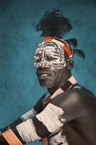 Black man wearing traditional body paint