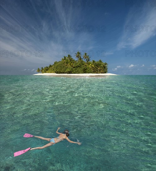 Caucasian woman snorkeling off tropical island