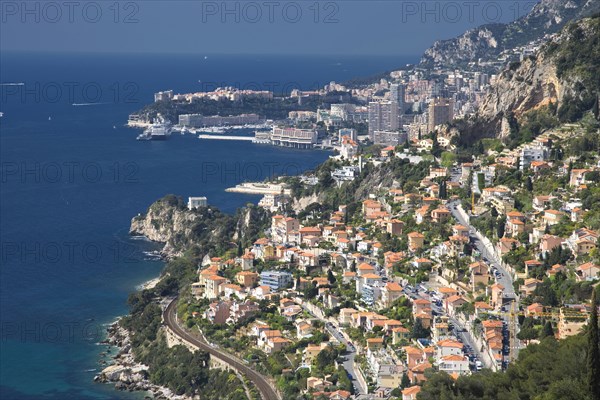 Aerial view of Monaco cityscape over ocean