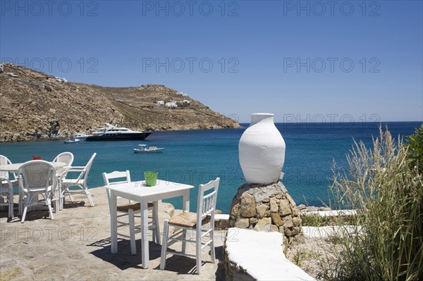 Patio overlooking ships in ocean bay