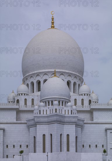 Ornate domed building under cloudy sky