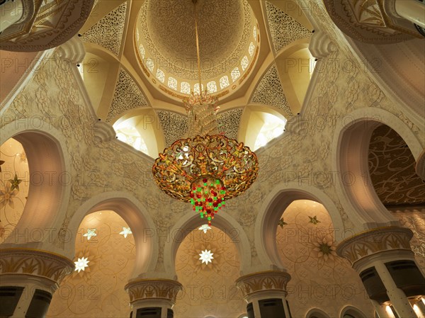 Low angle view of chandelier in ornate dome