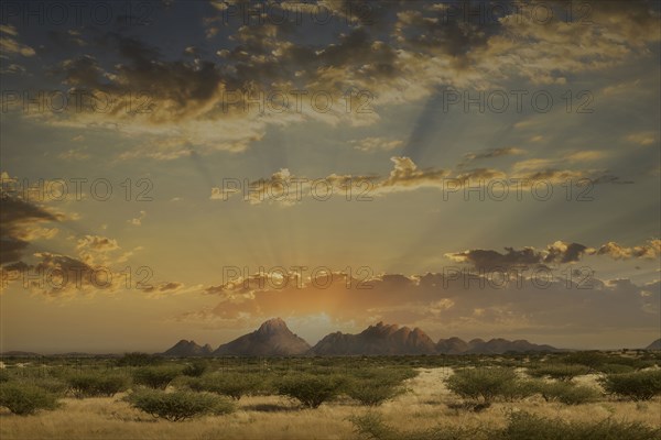 Dramatic sunrise over mountains in remote landscape