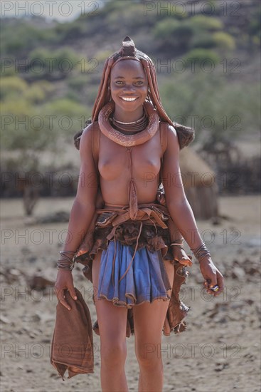 Black woman wearing traditional clothing and jewelry