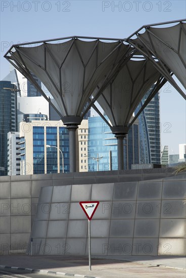 Roadsign under unique structures in Doha cityscape