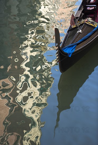 Gondola floating on urban canal