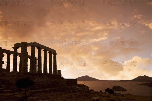 Temple of Poseidon under sunset sky