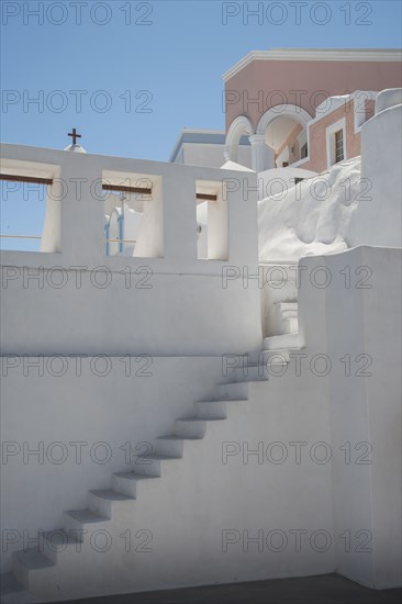 Steps on building wall under blue sky