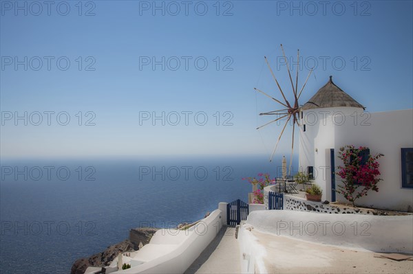 Building on hillside over cityscape