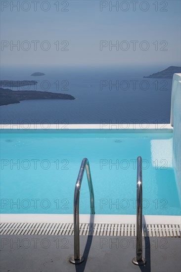 Swimming pool on hilltop over ocean