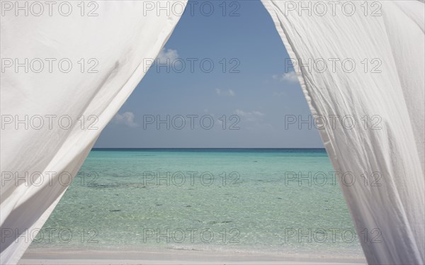 Curtains over ocean seascape