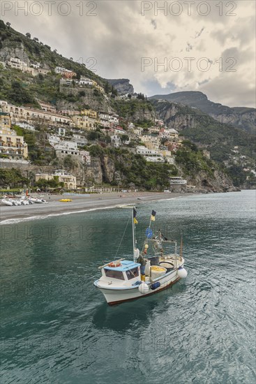 Boat sailing near Positano cityscape