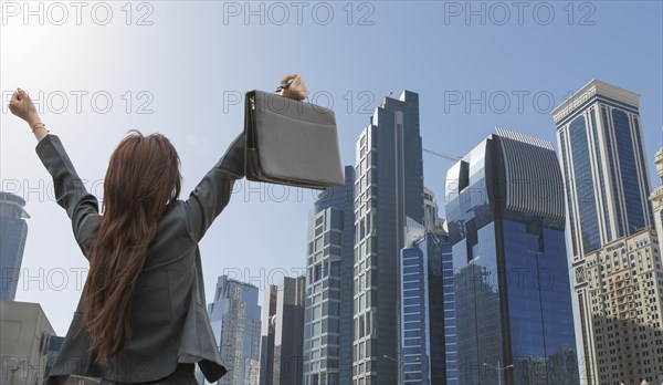 Chinese businesswoman cheering in Shanghai