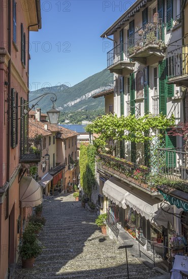 Staircase between buildings near lake