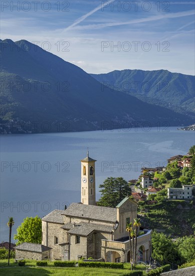 Aerial view of waterfront church and Lake Como