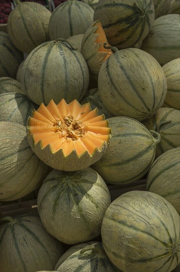 Sliced cantaloupe in pile