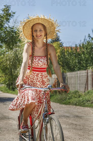 Caucasian woman riding bicycle