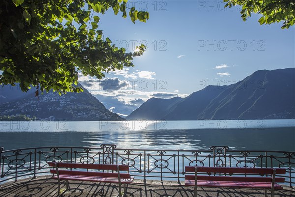 Benches overlooking mountains and remote lake