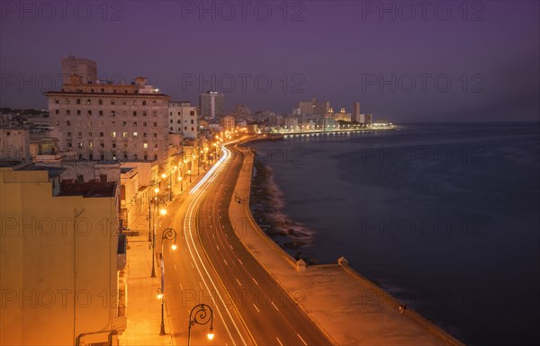 Long exposure of cars on waterfront at night