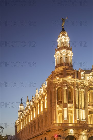 Illuminated historical building and sunset sky