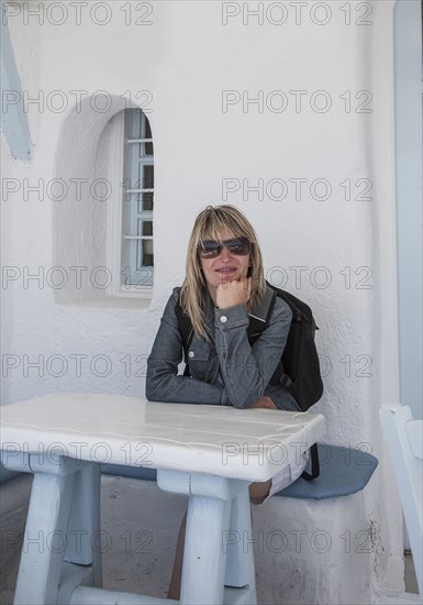 Caucasian woman sitting at table