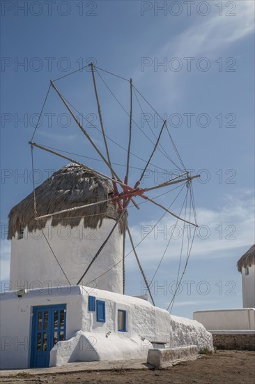 Traditional windmill under blue sky