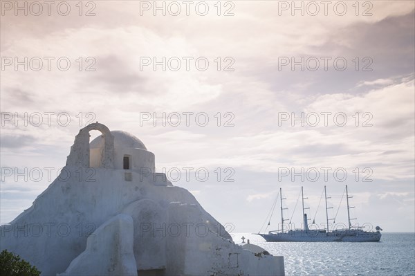 Boat sailing near traditional building