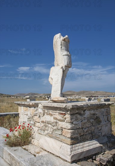 Statue ruins on stone pedestal