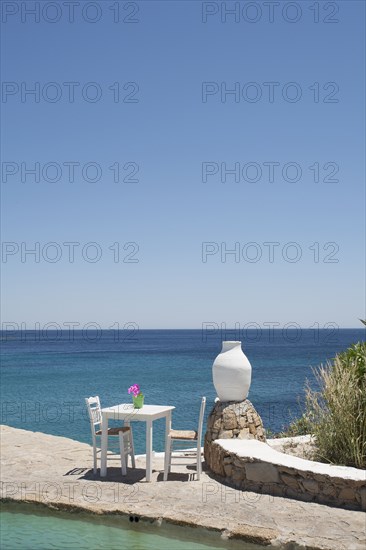 Table on balcony overlooking seascape