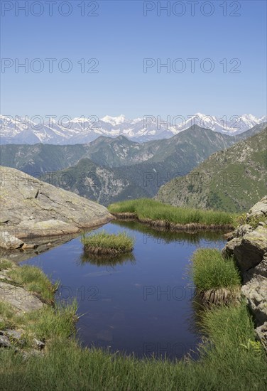 Pond on mountainside in Italian Alps
