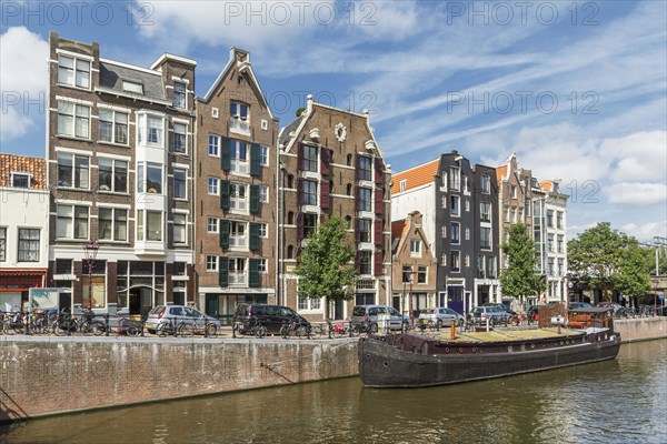 Boat docked on urban canal